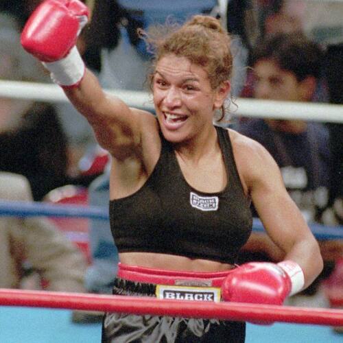 FILE - In this Sept. 13, 1997, file photo, Lucia Rijker, of the Netherlands, gestures after beating Andrea Deshong in a boxing match in Las Vegas. Rijker was elected to the International Boxing Hall of Fame, Wednesday, Dec. 4, 2019. (AP Photo/Lennox McLendon, File)